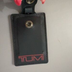 TUMI Black and Red Luggage Tag